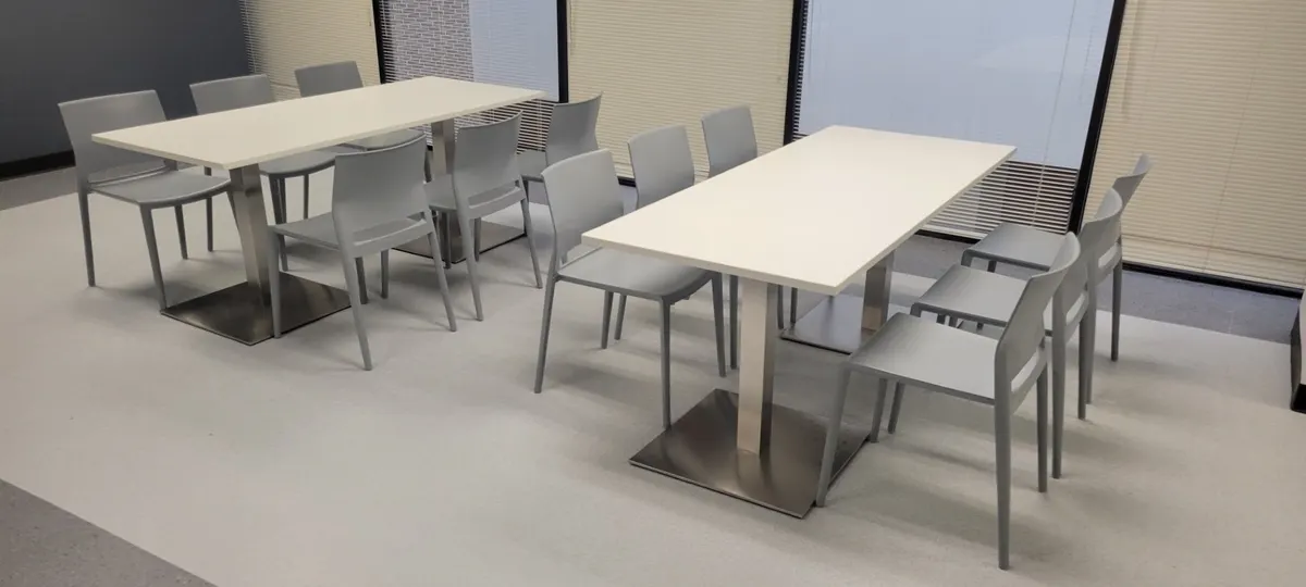 Office break room with tables and chairs installed by New Space