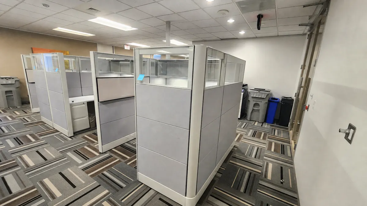 Herman Miller Ethospace workstations with glass stack panels on a finished office floor